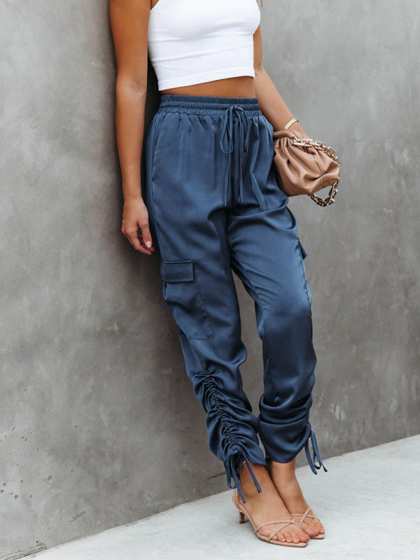 Women's chic blue satin cargo pants, combining the utility of cargo with luxurious satin fabric.