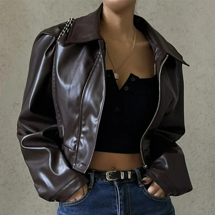 Edgy brown PU leather women's summer jacket with a notched collar, zip details, and a chic tailored fit for ladies.