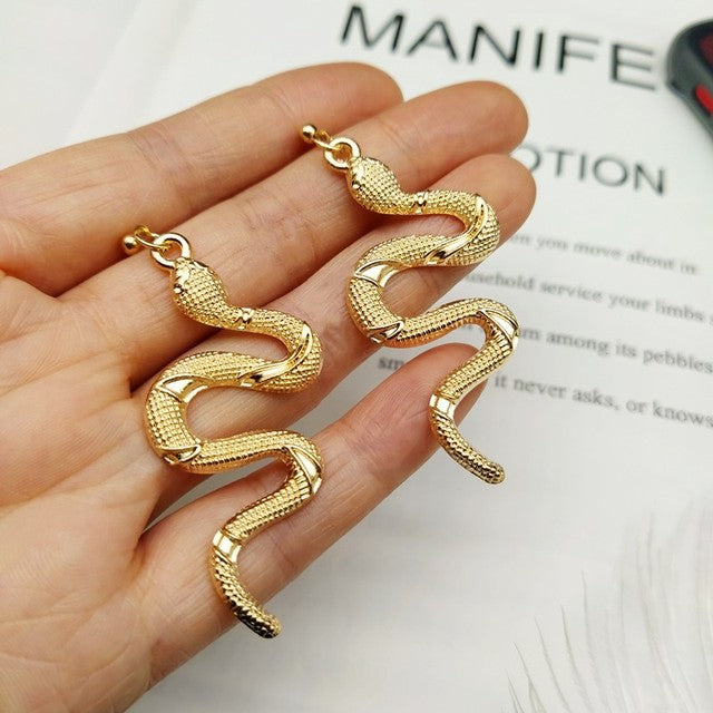 Chic crystal serpent earrings for women, elegant statement jewelry with sparkling crystals.