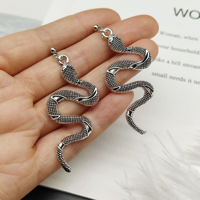 Sparkling crystal snake earrings, a sophisticated women's accessory & elegant serpent jewelry.