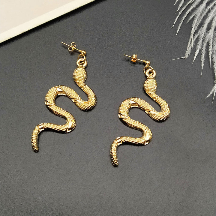 Glamorous crystal serpent earrings, chic women's accessory for elegant snake jewelry lovers.