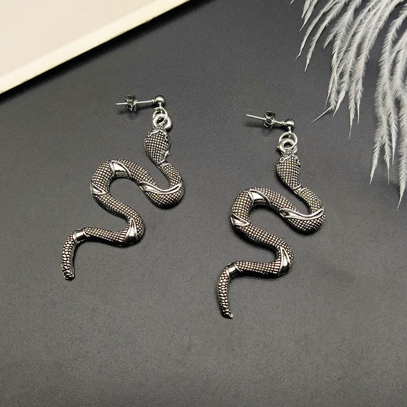 Modern crystal snake earrings, an elegant women's accessory, part of chic serpent jewelry.