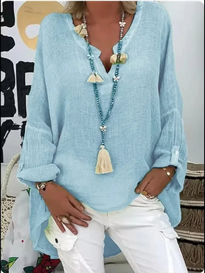 Chic oversized women's blouse with long sleeves, perfect for versatile summer fashion and casual elegant wear.