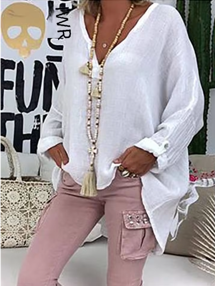 Chic women's oversized long-sleeve blouse, a fashion top for casual elegance and versatile summer styling.