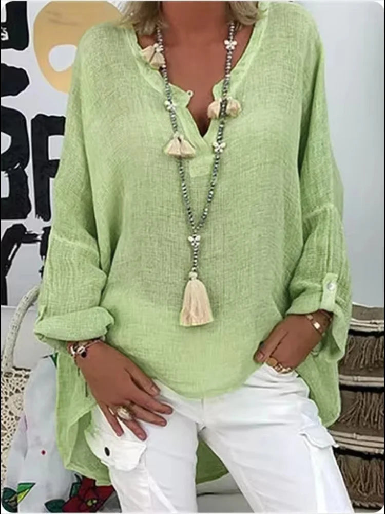 Effortless oversized women's blouse, a relaxed fit top perfect for summer fashion, beach, or casual elegant looks.