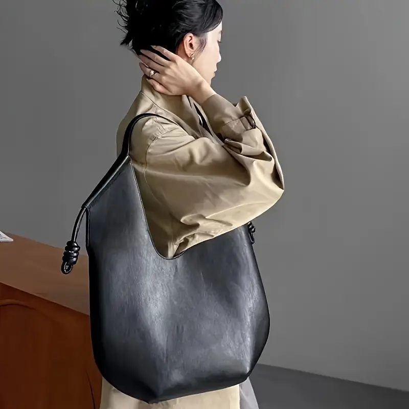 Cedar brown oversized vegan leather shoulder bag, a chic women's carryall with minimalist design.