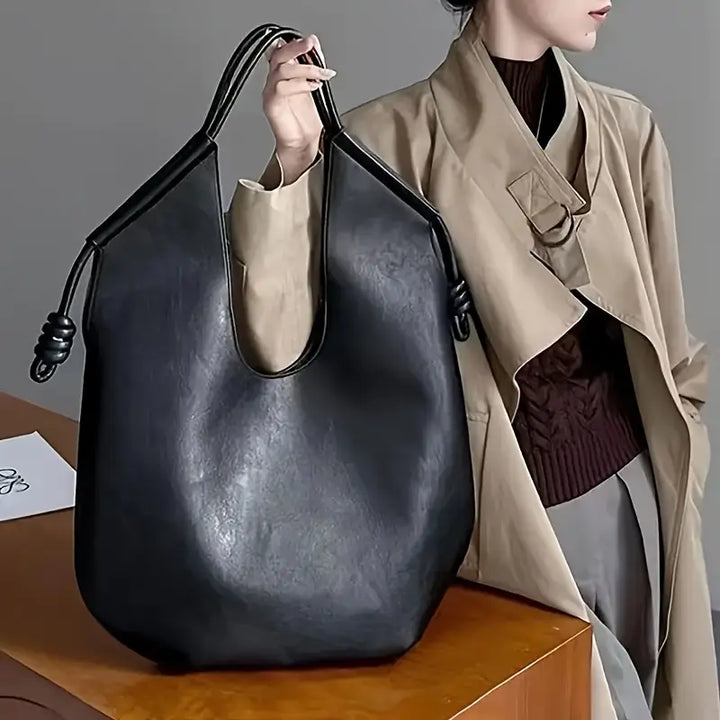 Minimalist chic women's oversized shoulder bag made from premium vegan leather.