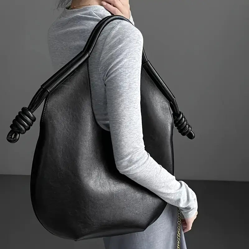 Interior view of a spacious women's vegan leather tote, revealing ample room for essentials.