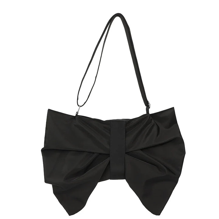 Large women's tote bag with a distinctive oversized bow. A trendy and spacious shoulder bag for women.