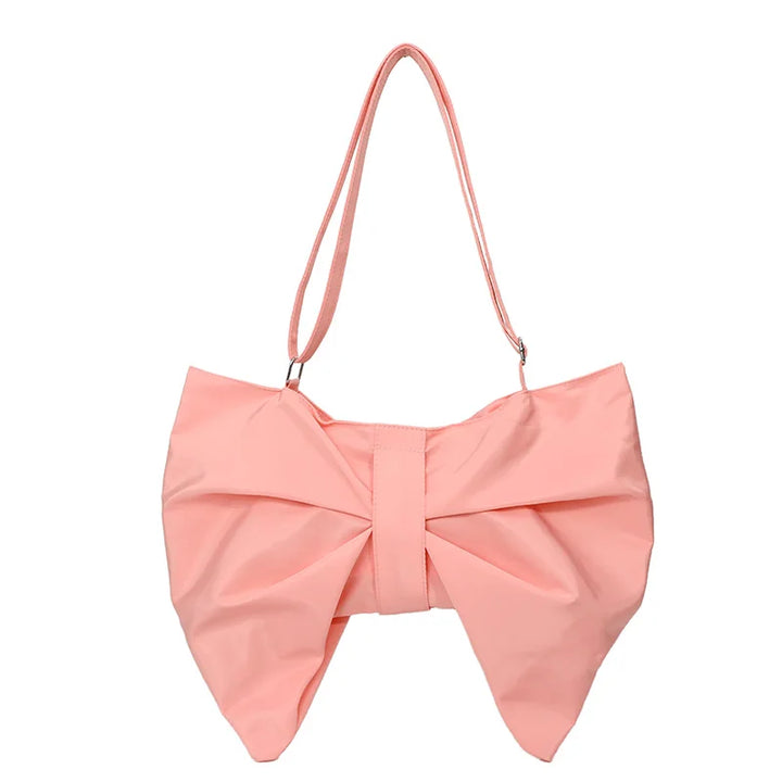 Elegant women's oversized tote bag. Features a chic bow. A stylish and practical shoulder bag.