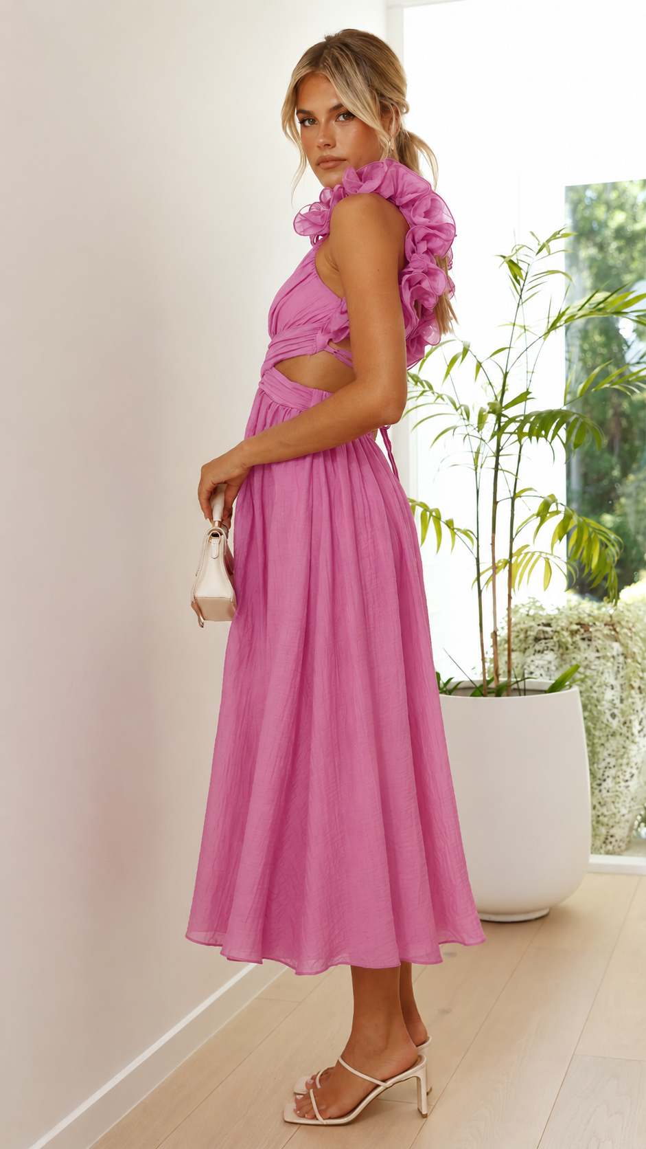 Elegant women's pink maxi dress, featuring chic ruffle details & a lace-up back for wedding guests.