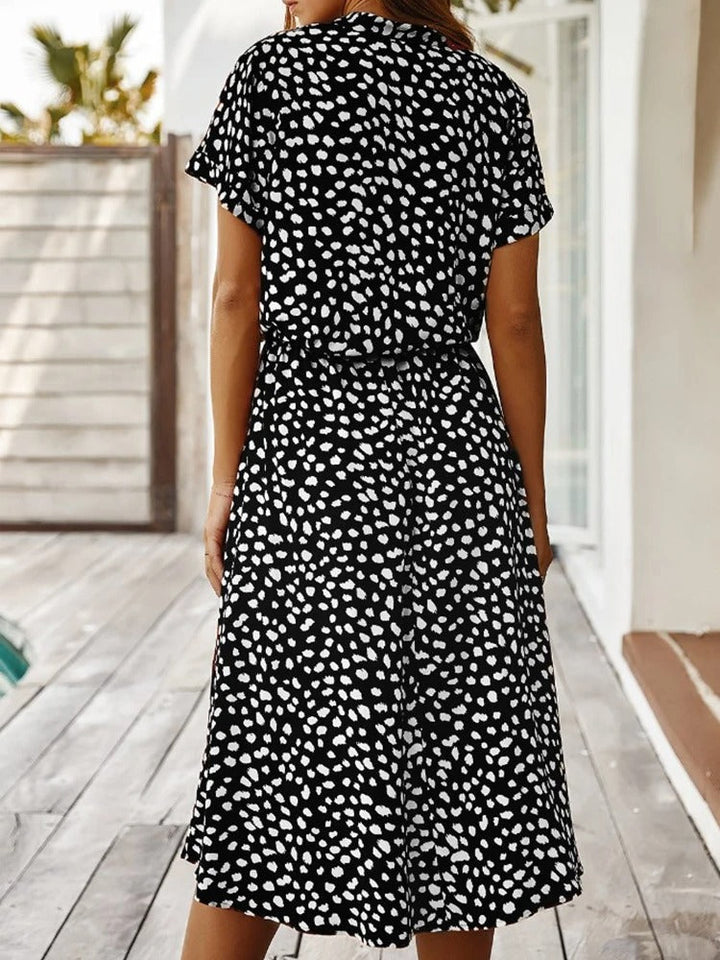 Women's chic printed summer midi dress, short sleeves. Comfortable, versatile day outfit.