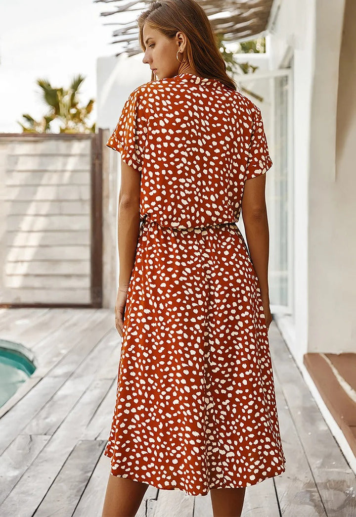 Stylish women's printed summer midi dress, chic short sleeve design, comfortable casual fashion.
