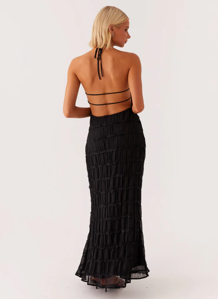 Elegant textured maxi dress, women's halter style. A sophisticated wedding guest or special occasion gown.