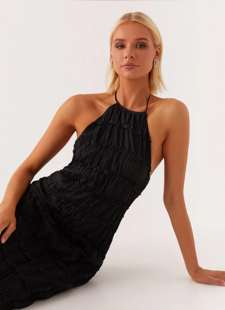 Formal evening gown: Women's textured halter maxi dress with stylish open back. Perfect for occasions.
