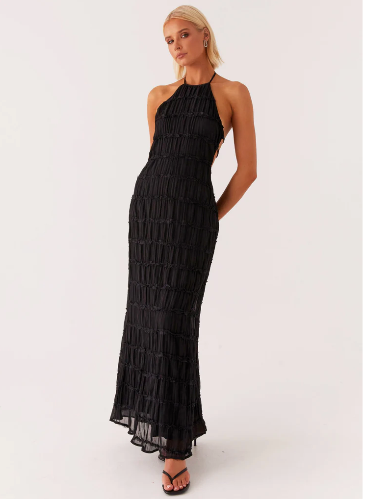 Elegant women's halter maxi dress with unique texture, perfect as a wedding guest or special occasion gown.