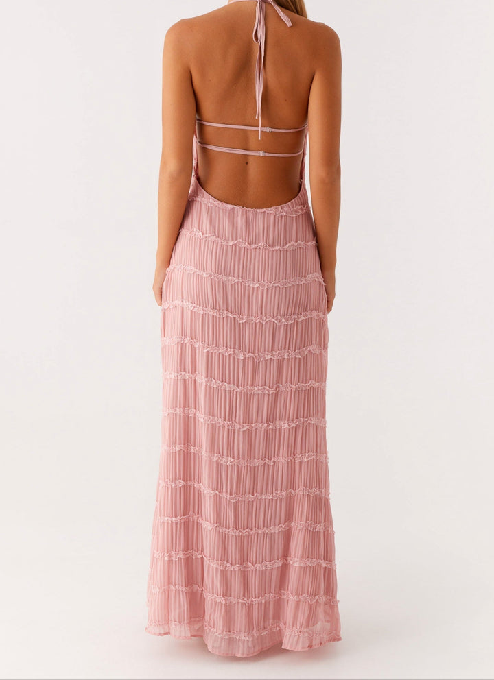 Stylish open-back halter maxi dress. Chic textured fabric, ideal for formal special occasions.