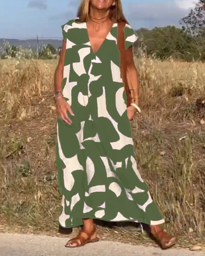 Versatile women's abstract print summer dress, flowy and chic, perfect for casual or day wear.