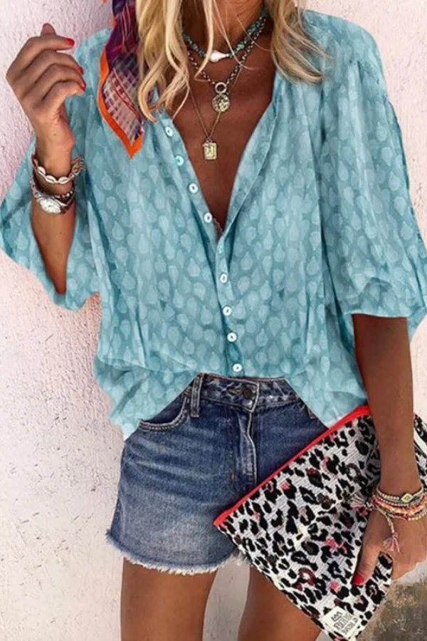Chic women's airy button-front blouse, perfect for summer casual wear. Lightweight & stylish top.