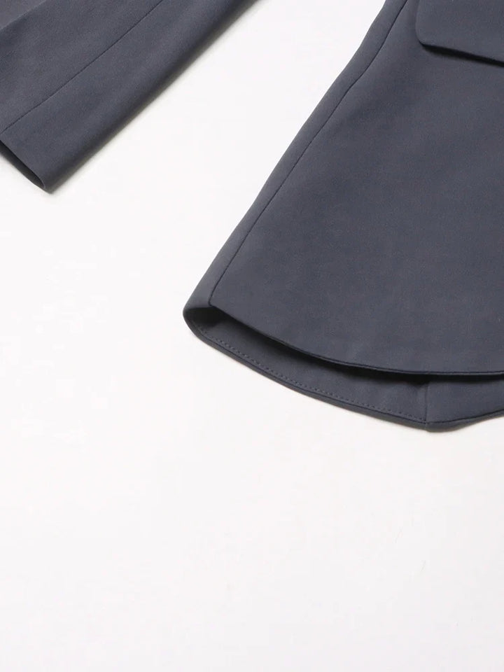 Versatile black asymmetric blazer with unique cutout design, ideal for chic professional or evening wear.