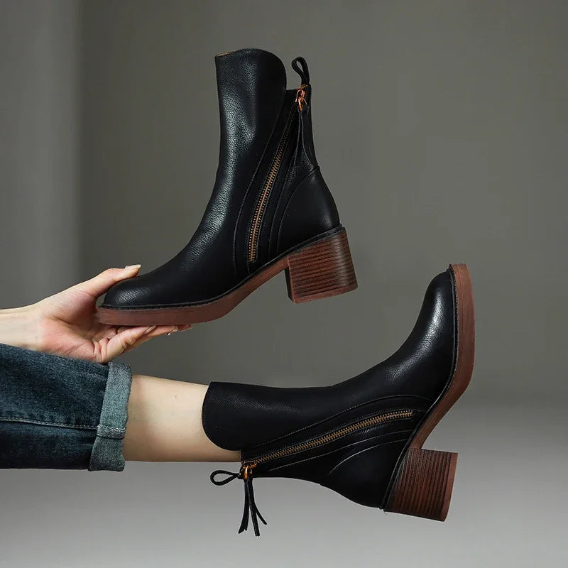 Chic women's black ankle boots with a comfortable block heel & side zip, perfect for everyday fashion style.
