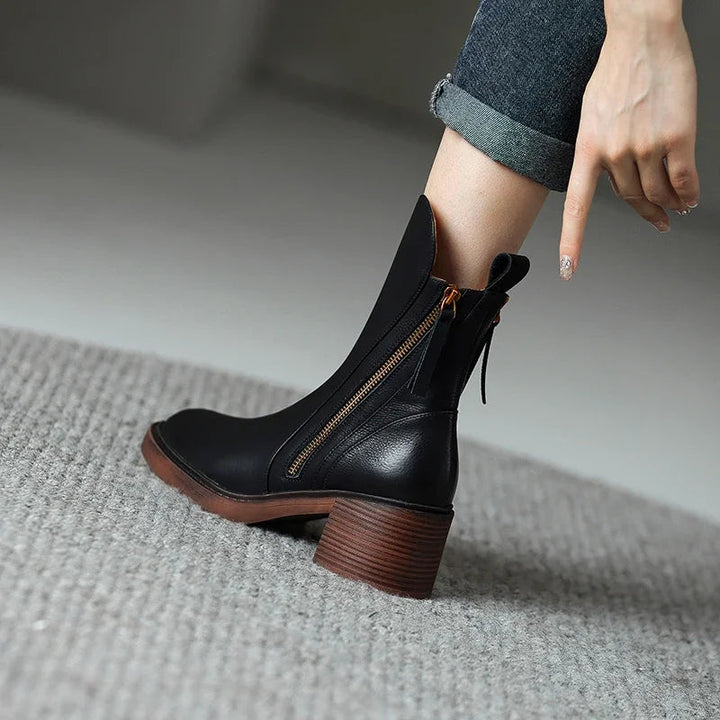 Stylish women's ankle boots with a sturdy block heel & convenient side zip, ideal for comfortable everyday wear.