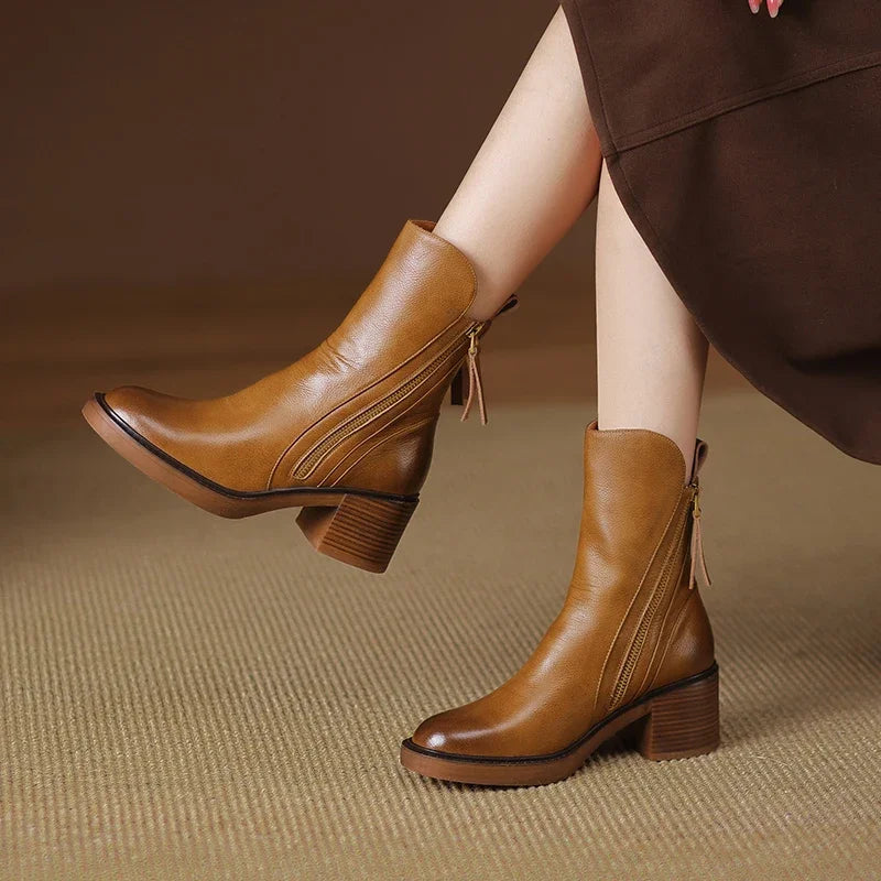 Elegant women's ankle boots, designed for everyday style & comfort with a practical side zip and block heel.