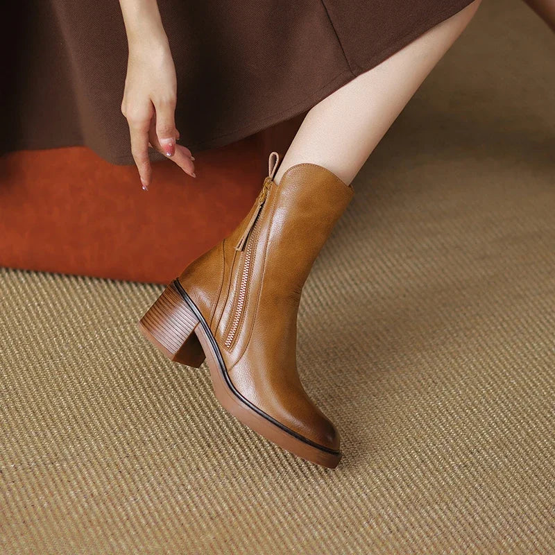 Comfortable women's chic ankle boots with a supportive block heel & easy side zip, enhancing any everyday outfit.