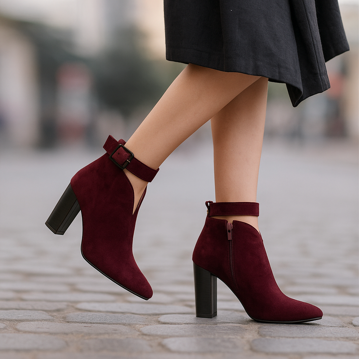 Women's fashion ankle boots featuring stylish buckle detail, pointed toe & comfortable block heel.