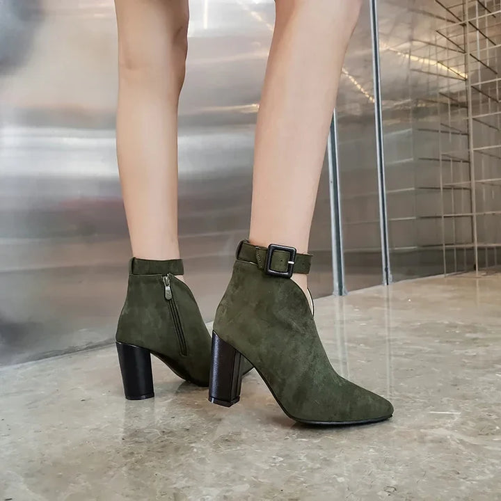 Back view of women's comfortable ankle boots with block heel & chic buckle detail.