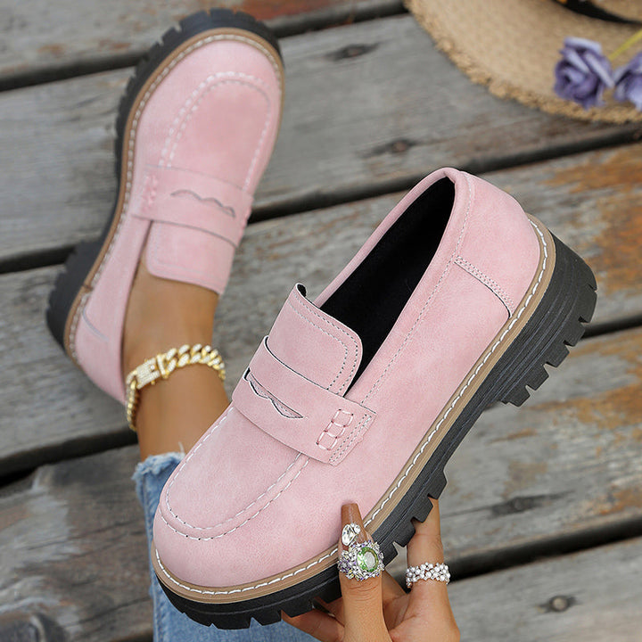 Elegant women's platform loafers with a modern silhouette for stylish comfort.