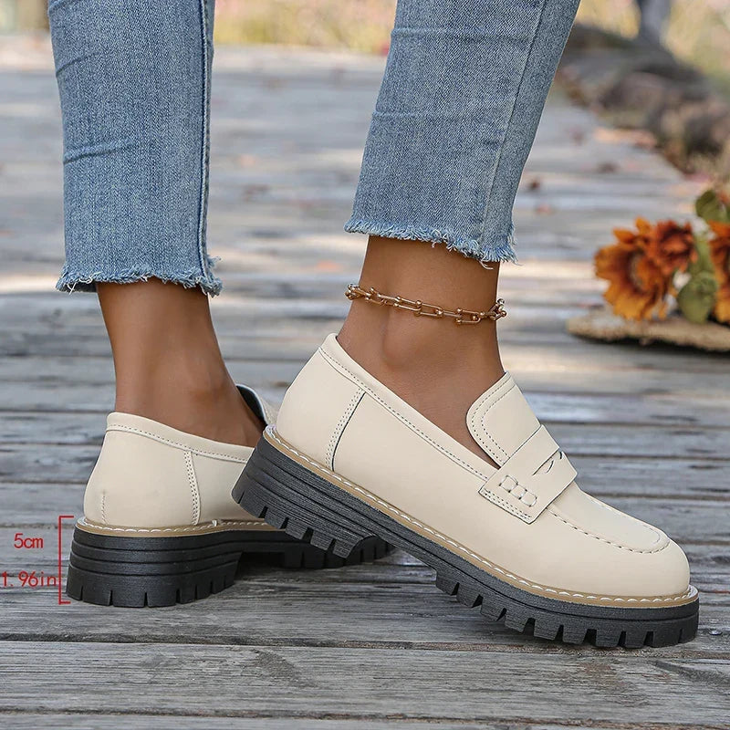Stylish women's slip-on platform loafers, perfect for casual or dressy outfits.