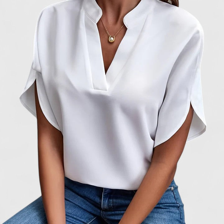 Chic women's blouse for effortless everyday style. Versatile top perfect for office or casual spring/summer wear.