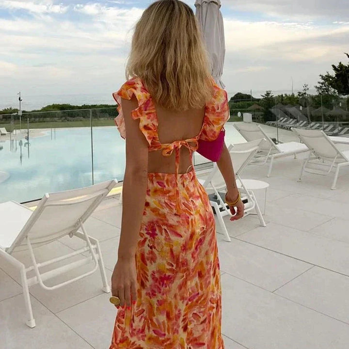 Flowy bohemian print ruffle dress for women, ideal as a stylish summer or evening dress with a chic vibe.