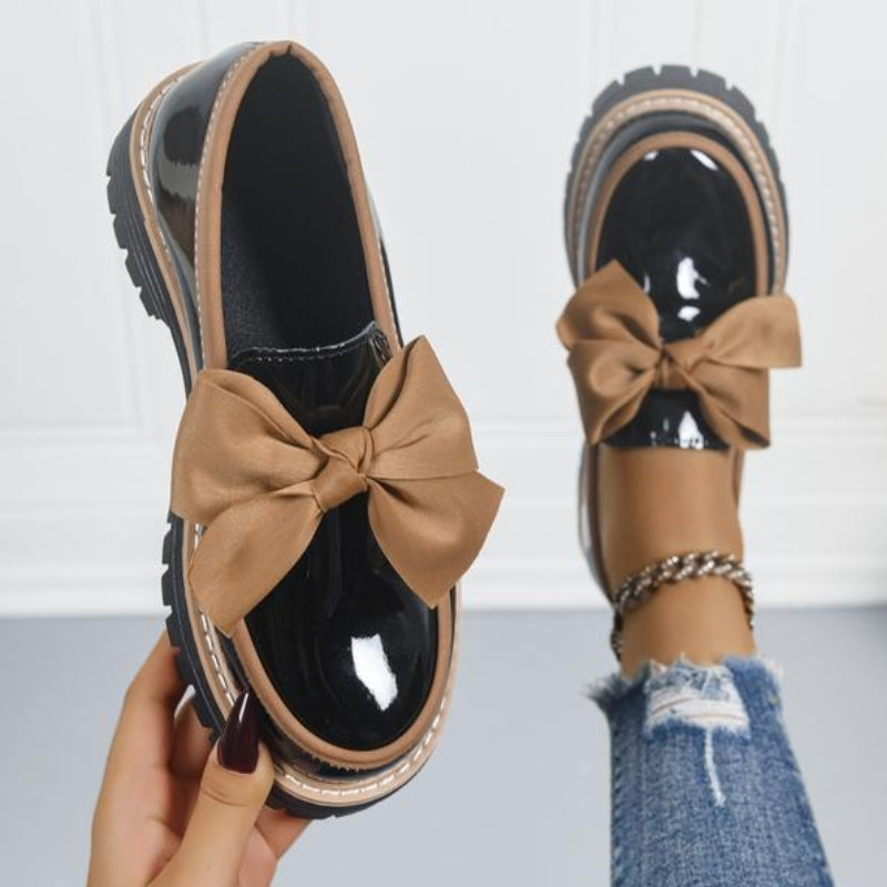 Chic women's bowknot loafers. Comfortable slip-on design, perfect everyday casual footwear with elegant style.