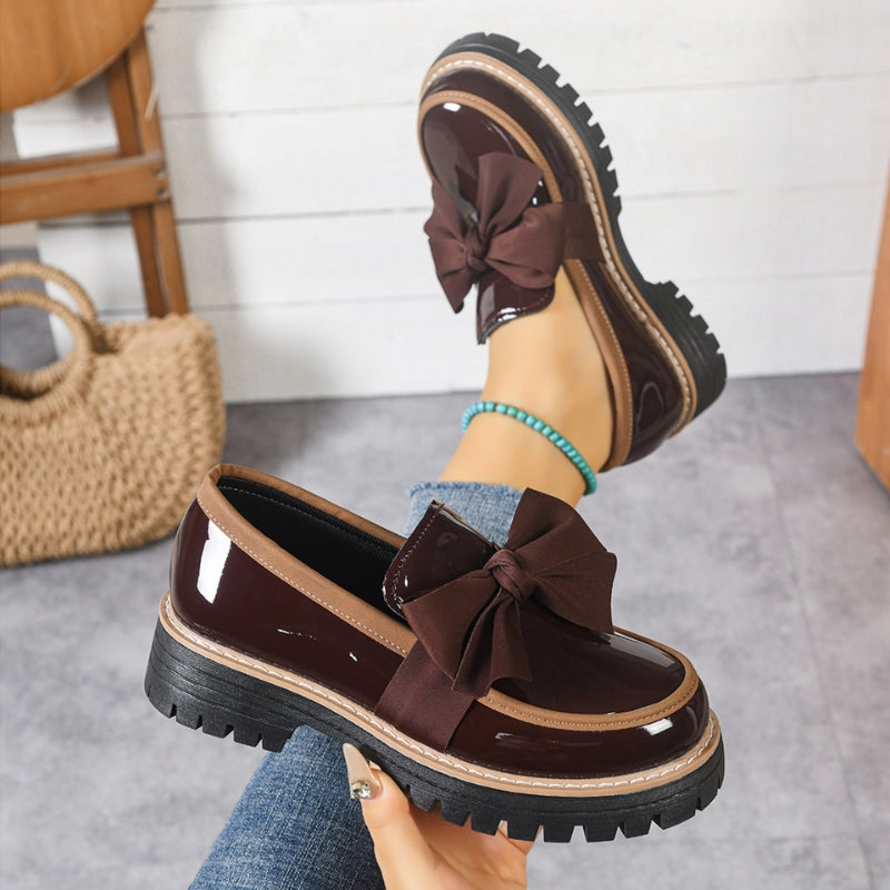 Easy slip-on women's bowknot loafers. Comfortable and chic, perfect for adding a touch of elegant style to any outfit.