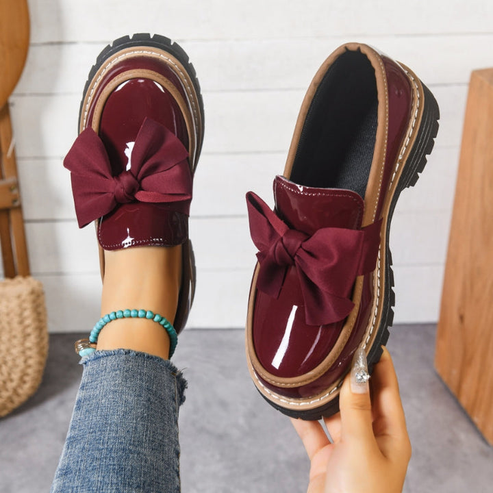 Trendy women's bowknot loafers. Comfortable platform slip-ons, adding a stylish and chic touch to your casual footwear.