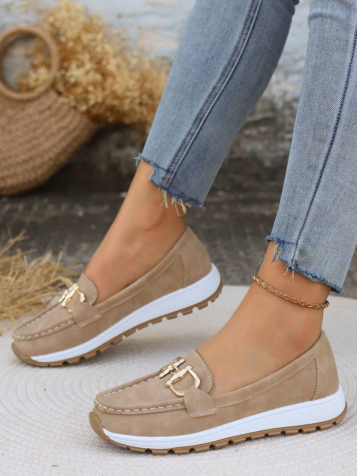 Classic women's buckle loafers, sleek flat slip-on design for comfortable & chic everyday style.