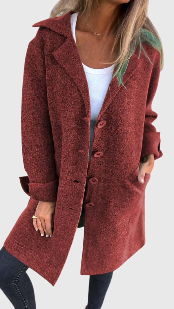 Professional woman seated in a comfortable button-detail blazer, perfect for business casual meetings & office.