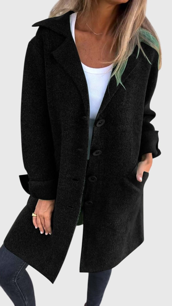 Front view of a modern women's button blazer, showcasing chic design & tailored construction for business casual.