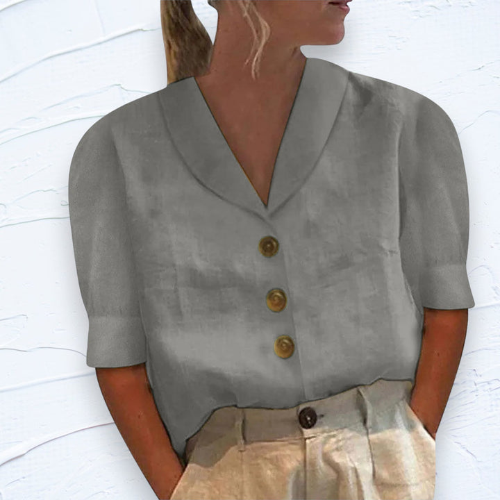 Modern chic women's button-down blouse with a collar. Versatile solid top for spring & summer fashion trends.