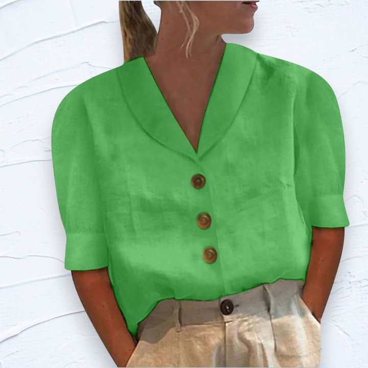Stylish women's collared button-down blouse. Great for spring fashion, office wear, or casual elegant everyday looks.