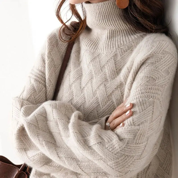 Chic women's chevron knit turtleneck pullover sweater in an oversized, relaxed fit for stylish fall & winter fashion.