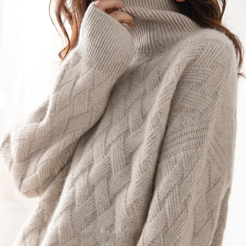 Warm, stylish women's oversized turtleneck sweater with a unique chevron knit pattern, perfect for casual winter days.