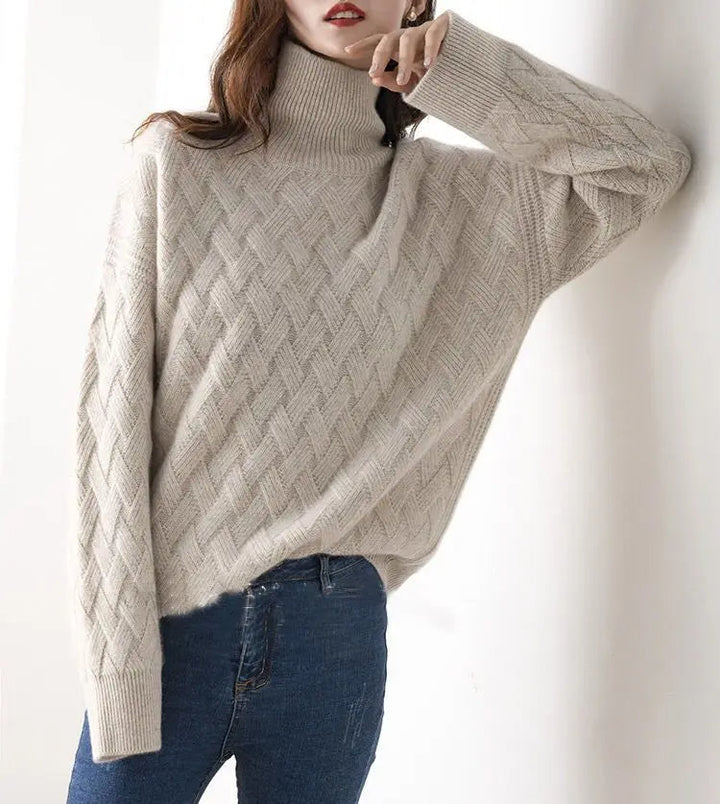 Model wearing a cozy, chic women's oversized chevron turtleneck pullover sweater, showcasing its relaxed fit.