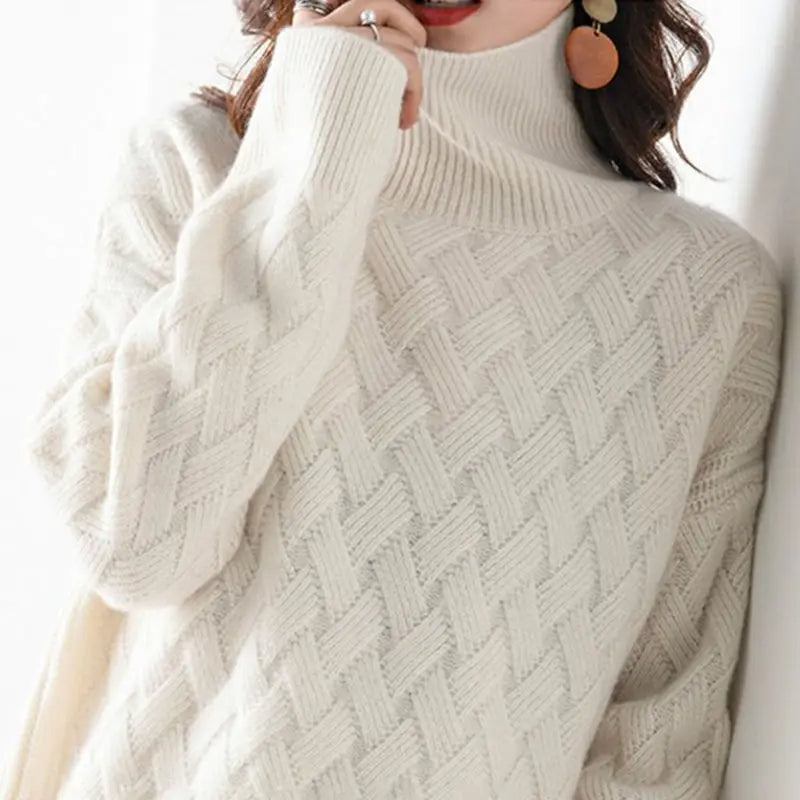 Close-up of a fashionable women's chevron knit turtleneck sweater, highlighting its unique texture & cozy style.