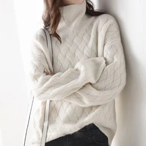 Elegant women's oversized chevron knit turtleneck sweater, a warm & chic pullover perfect for winter fashion.