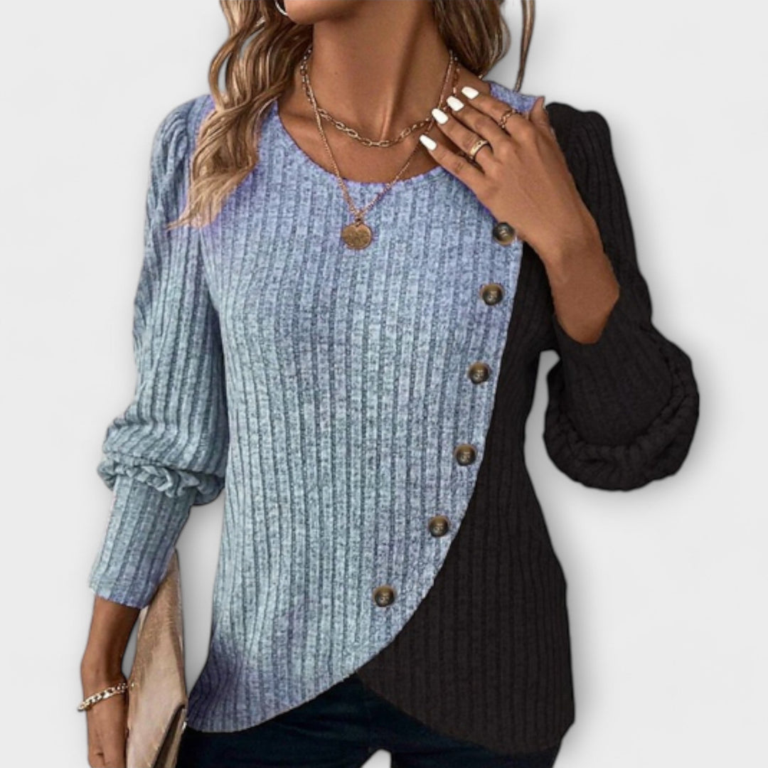 Modern women's long sleeve colorblock blouse, featuring a unique asymmetric design for a stylish and fashion-forward look.