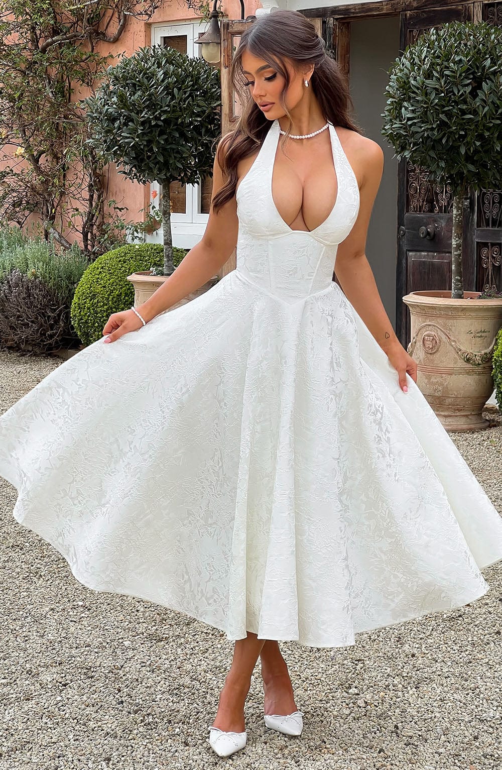 Formal women's A-line midi dress, featuring a chic corset halter design, perfect for elegant wedding guests.