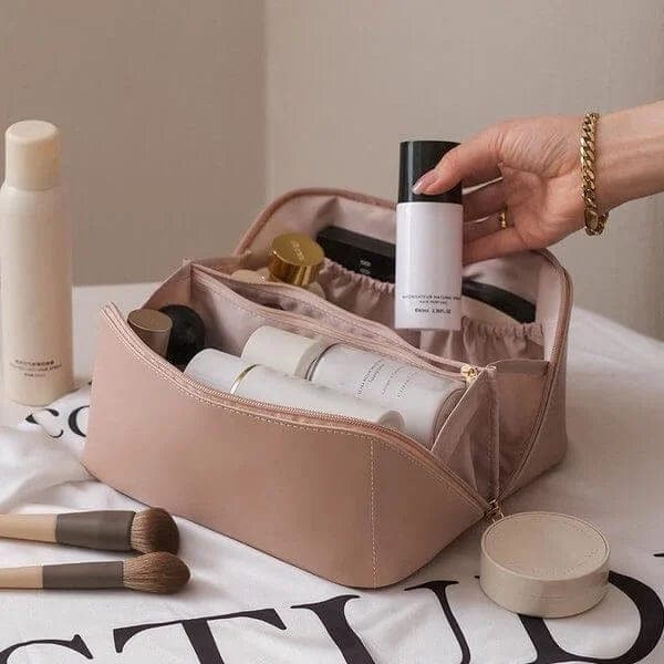 Chic women's cosmetic bag with multiple compartments for organized makeup, perfect for travel or daily use.